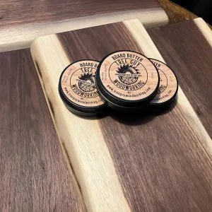 a group of round wooden coasters on a wooden surface